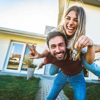 Happy couple buying a property